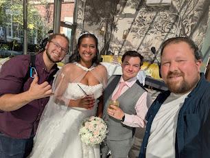 Chris with happy wedding couple