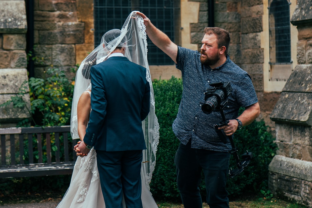 Chris guiding a wedding couple during their photoshoot
