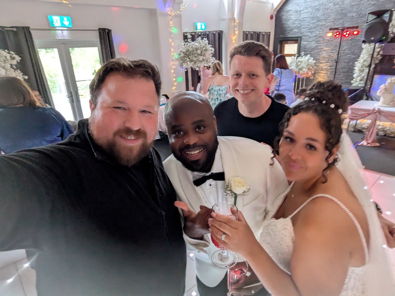 Chris with wedding couple after ceremony