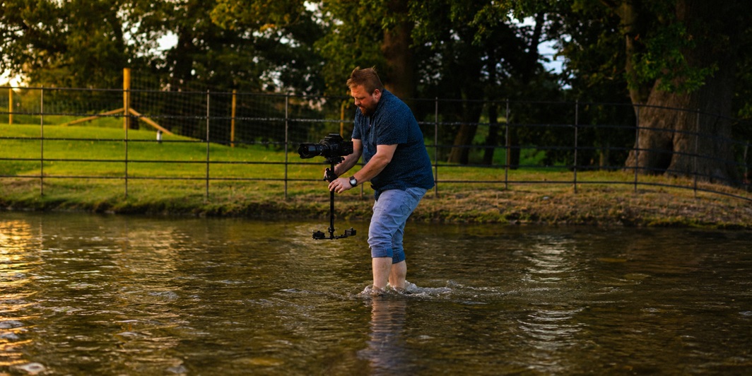 Chris Jezierski filming in water with a camera gimbal — West Midlands wedding videographer